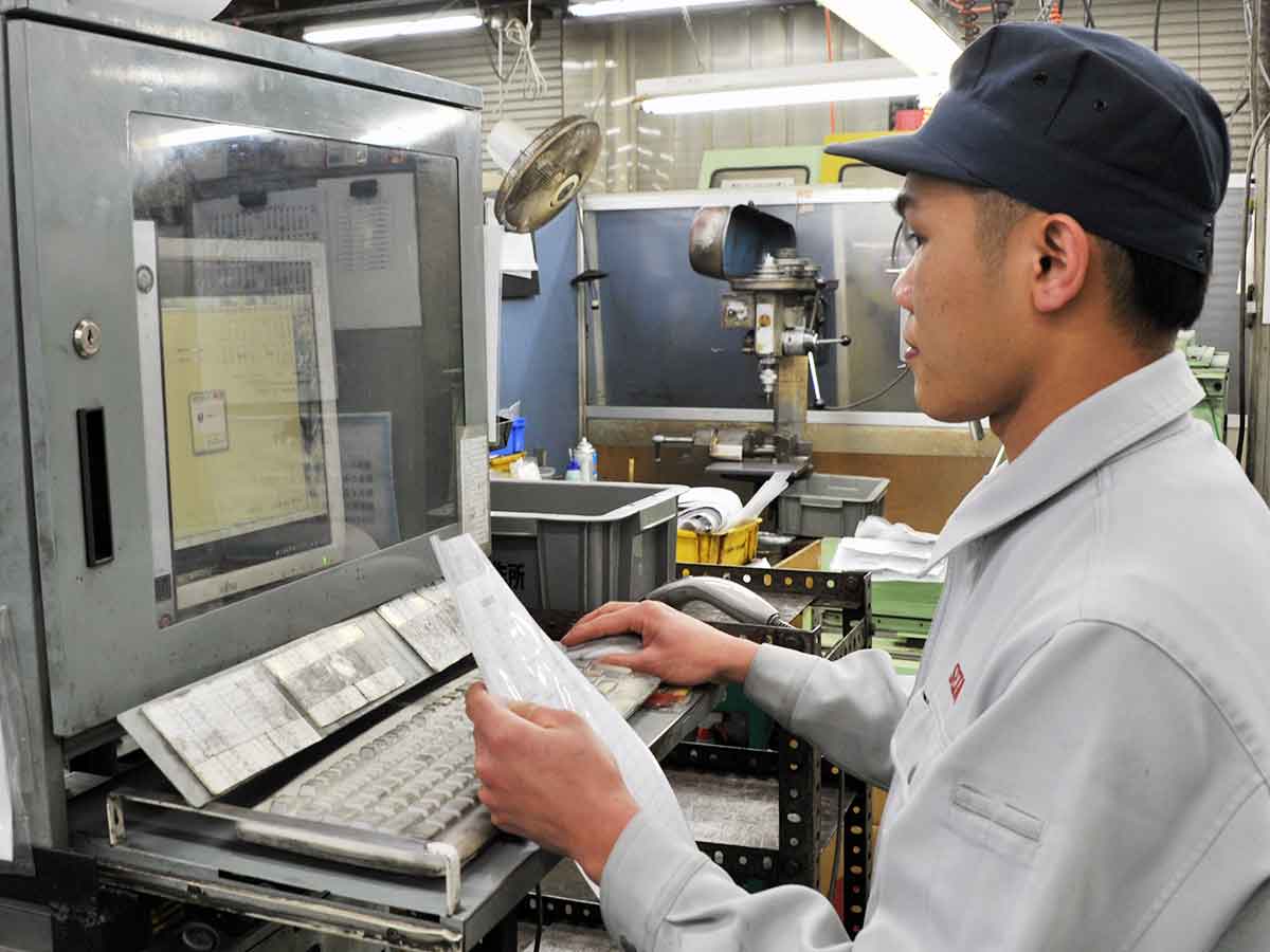 Our staff manipulating computers in the plant